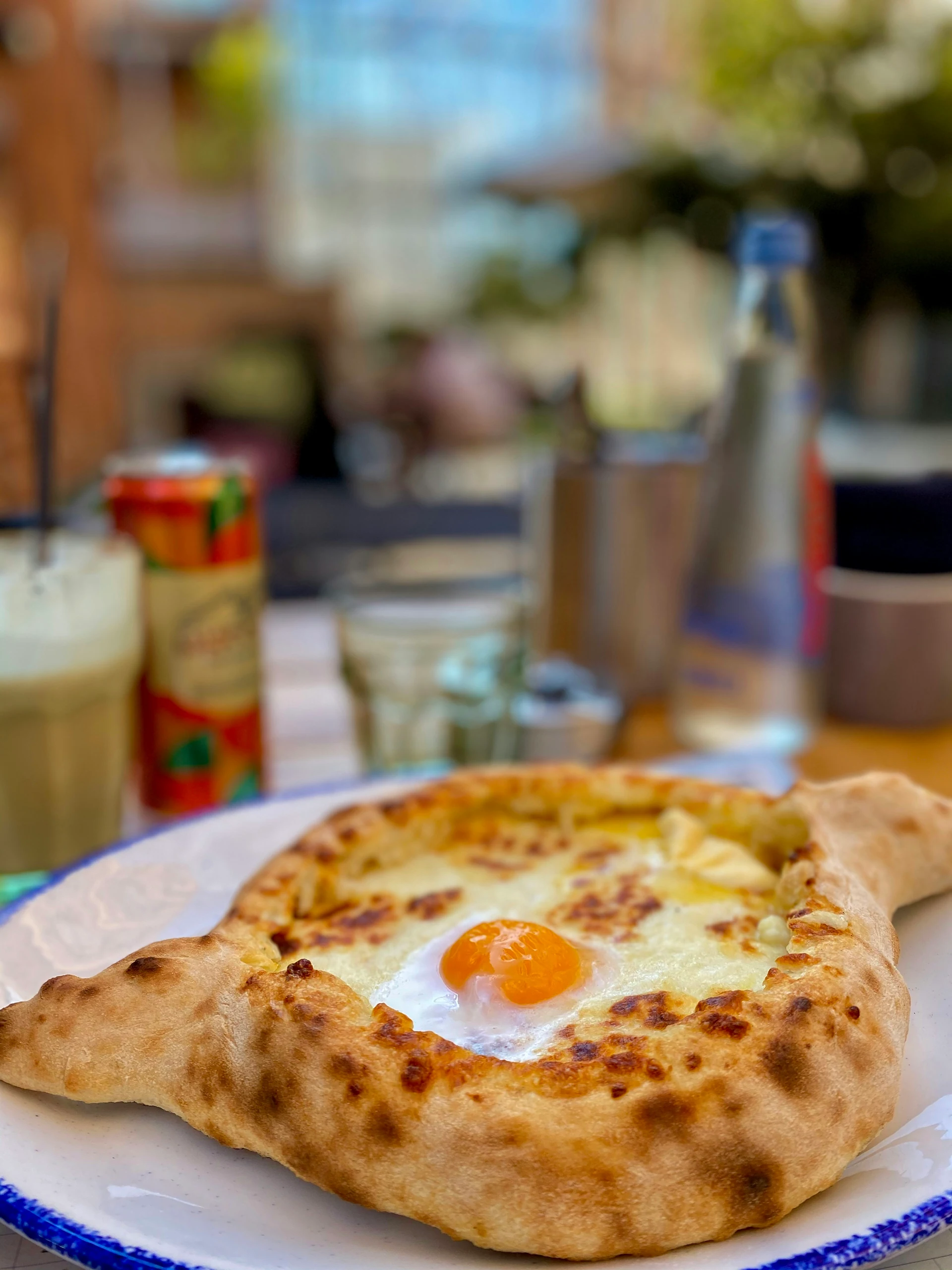 Fresh Adjarian khachapuri with melted cheese, egg and butter